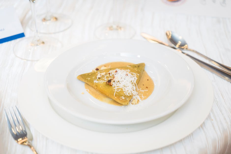 Delicious gourmet dish served elegantly with cheese garnish, perfect for culinary enthusiasts