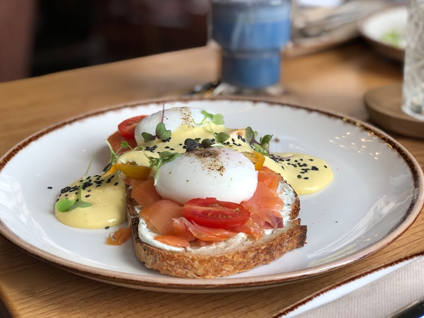 A delicious brunch dish featuring smoked salmon, poached eggs, and hollandaise sauce on toast